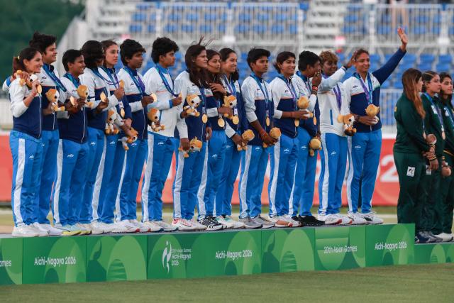 Gold medallists India stand on the podium for the women's cricket event during the 2026 Asian Games at Korogi Athletic Park in Nisshin, Aichi prefecture on September 22, 2026. (Photo by DAVID GRAY / AFP)