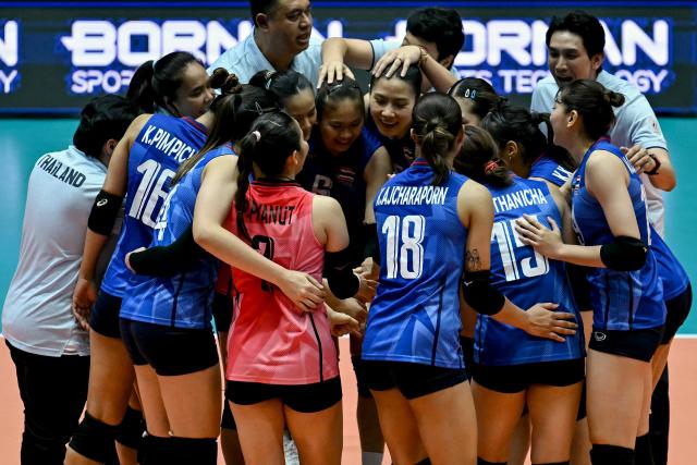 Thailand's players celebrate their team's victory at the end of the women's volleyball bronze medal final match between South Korea and Thailand during the 2026 Asian Games at the Park Arena Komaki in Komaki, Aichi prefecture on September 22, 2026. (Photo by MOHD RASFAN / AFP)