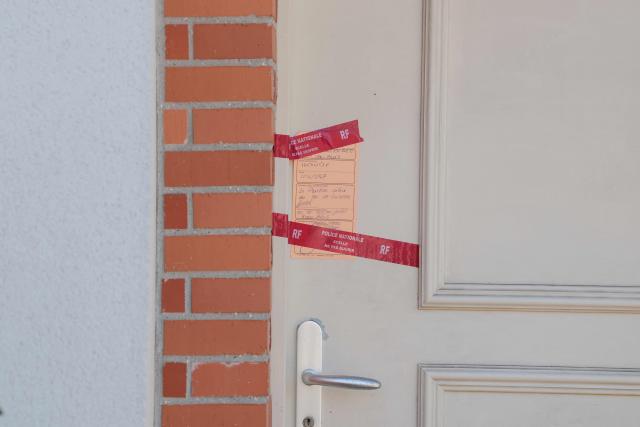 This picture shows a police seal on the door of a house where a five-year-old girl was found dead in Blois, central France, on September 22, 2026. A five-year-old girl was found dead in Blois at the home of her father who "presumably killed her" before attempting to take his own life, the public prosecutor’s office told AFP on September 22. (Photo by Alain JOCARD / AFP)