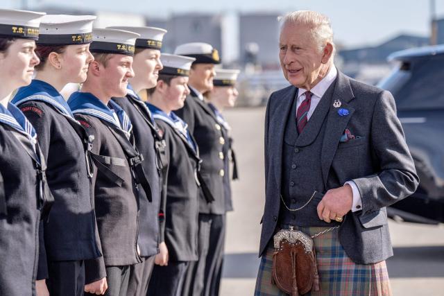 Britain's King Charles III (R) meets members of the Sea Cadets during a visit to Peterhead Port, Aberdeenshire, Scotland on September 22, 2026, to meet organisations involved in the area's local energy ecosystem, helping to drive the UK's transition to clean and renewable energy. (Photo by Jane Barlow / POOL / AFP)