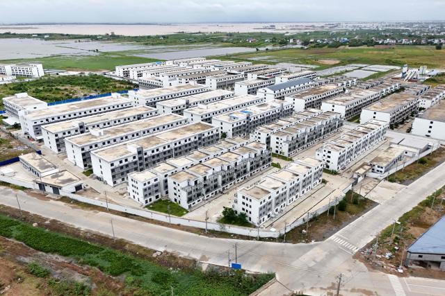 An aerial view of a closed online scam compound under the Jin Zi Hui Property Management is seen in Kandal province on September 22, 2026. Cambodia this week hosts officials from more than 20 countries for a conference on combating online scammers, seeking to showcase its own crackdown under increasing international pressure. (Photo by Suy SE / AFP)
