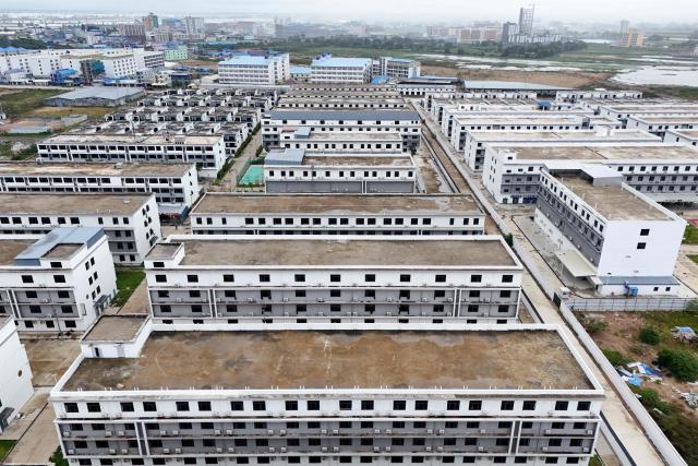 An aerial view of a closed online scam compound under the Jin Zi Hui Property Management is seen in Kandal province on September 22, 2026. Cambodia this week hosts officials from more than 20 countries for a conference on combating online scammers, seeking to showcase its own crackdown under increasing international pressure. (Photo by Suy SE / AFP)