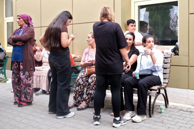 Relatives of injured people wait at Turgutlu state hospital after a gunman opened fire wounding eleven people outside a high school, and was detained shortly afterwards, in Turgutlu, an area west of the resort city of Izmir, on September 22,2026. A teenager opened fire outside a high school in western Turkey on Tuesday, wounding 11 people before being detained by police, a minister said. The incident happened around 8:00 am (0500 GMT) in Turgutlu in Manisa province, near the western resort city of Izmir, the regional governor's office said. (Photo by Ilker ERAY / AFP)