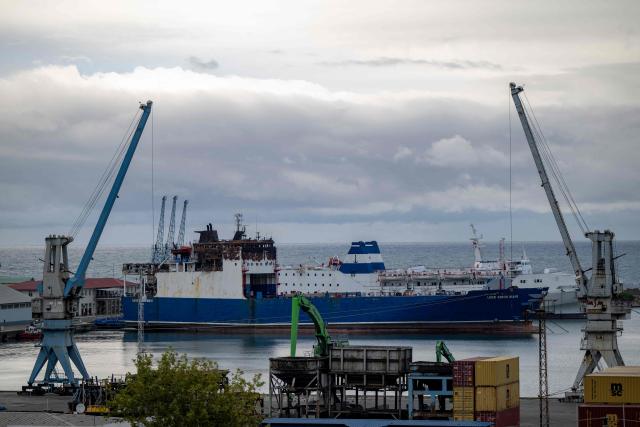 The damaged Turkish flagged Lider Bordo Mavi container ship is parked at the Trabzon port after being attacked near the Russian port of Tuapse, in the province of Trabzon on September 15, 2026. Attacks on commercial vessels have multiplied in recent months as the Russia-Ukraine war has spilled into the Black Sea, with Turkish ships increasingly in the firing line. (Photo by Yasin AKGUL / AFP)