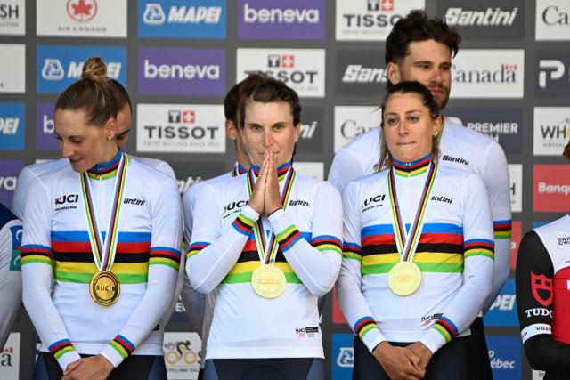 Italy’s team celebrates on the podium after winning the mixed relay team time trial during the 2026 Union Cycliste Internationale (UCI) Road World Championships in Montreal, Quebec, on September 22, 2026. (Photo by Andrej Ivanov / AFP)