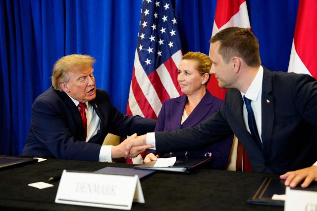 US President Donald Trump (L) shakes hands with Greenland's Prime Minister Jens-Frederik Nielsen (R) as Denmark's Prime Minister Mette Frederiksen looks on during a signing ceremony for a trilateral security agreement between the United States, Denmark and Greenland on the sidelines of the 81st United Nations General Assembly in New York on September 22, 2026. (Photo by Mads Claus Rasmussen / Ritzau Scanpix / AFP) / Denmark OUT
