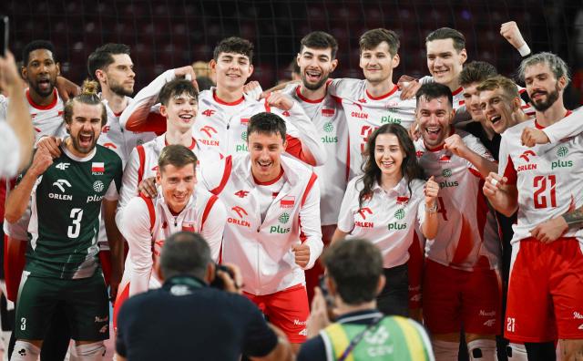 Poland’s players celebrate after winning the CEV EuroVolley 2026 men's volleyball quarterfinal match against Germany at Arena 8888 in Sofia on September 22, 2026. (Photo by Nikolay Doychinov / AFP)
