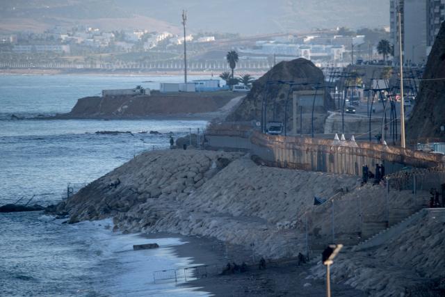 A picture taken on September 22, 2026 shows a view of the Tarajal border crossing between Morocco and the Spanish enclave of Ceuta, following social media calls for mass attempts to cross into Ceuta from Morocco. Under pressure to contain migration after a crisis in Ceuta on July 30 and 31, Spain's government had insisted that no irregular migrants would be allowed to reach the mainland. On those days more than 70,000 migrants streamed into Ceuta from Morocco in an unprecedented, chaotic surge that left scores dead and sparked European Union infighting over the sensitive topic of immigration. (Photo by Antonio Sempere / AFP)