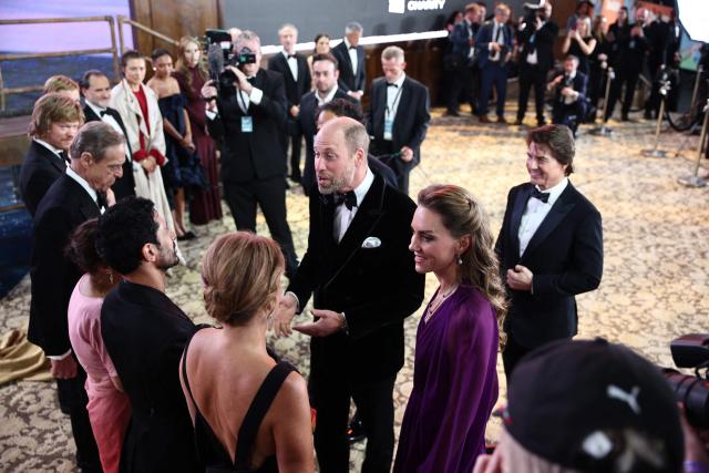Britain's Prince William, Prince of Wales and Britain's Catherine, Princess of Wales speak with members of the cast as they arrive for the global premiere of the film 'Digger' in Leicester Square in central London on September 22, 2026. (Photo by Henry Nicholls / AFP)