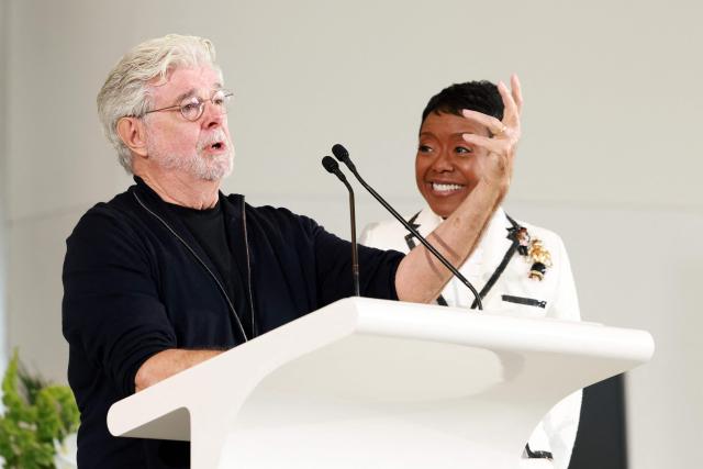 US businesswoman Mellody Hobson watches her husband US filmmaker George Lucas speak at the Lucas Museum of Narrative Art as it opens to the public on September 22, 2026, in Los Angeles. (Photo by VALERIE MACON / AFP)
