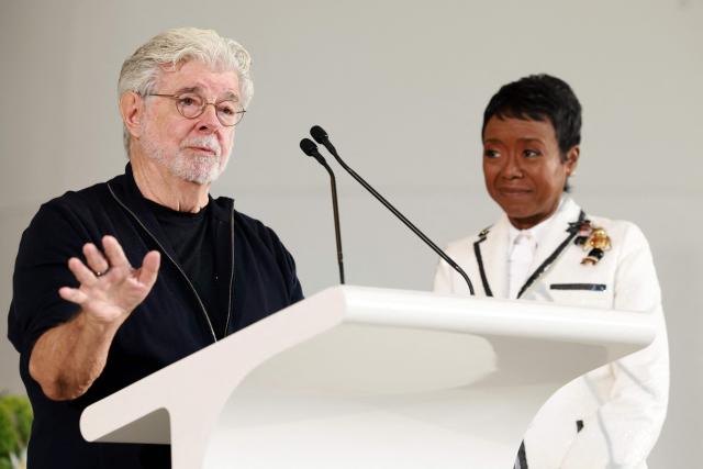 US businesswoman Mellody Hobson watches her husband US filmmaker George Lucas speak at the Lucas Museum of Narrative Art as it opens to the public on September 22, 2026, in Los Angeles. (Photo by VALERIE MACON / AFP)