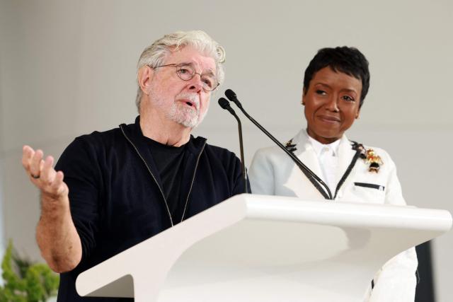US businesswoman Mellody Hobson watches her husband US filmmaker George Lucas speak at the Lucas Museum of Narrative Art as it opens to the public on September 22, 2026, in Los Angeles. (Photo by VALERIE MACON / AFP)