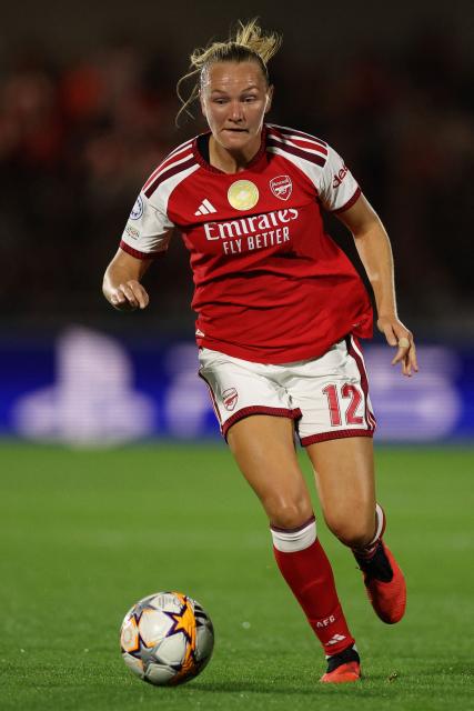 Arsenal's Norwegian midfielder #12 Frida Maanum runs with the ball during the UEFA Women's Champions League, League Phase football match between Arsenal and HB Koge at Meadow Park in Borehamwood, north of London on September 22, 2026. (Photo by Adrian Dennis / AFP)