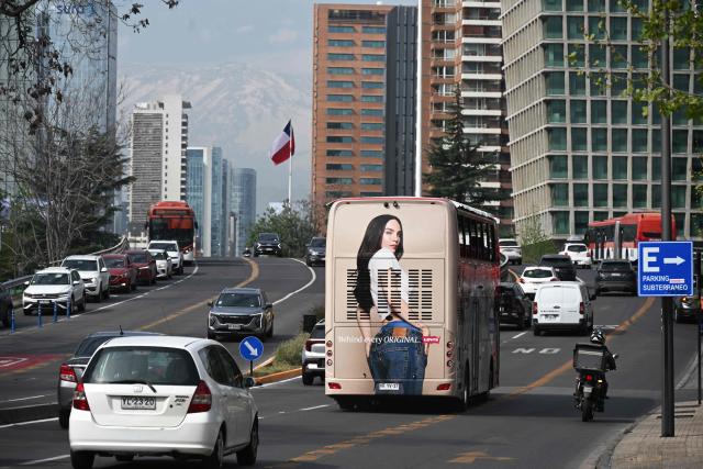 Vehicles travel along an avenue on World Car-Free Day in Santiago on September 22, 2026. (Photo by RODRIGO ARANGUA / AFP)