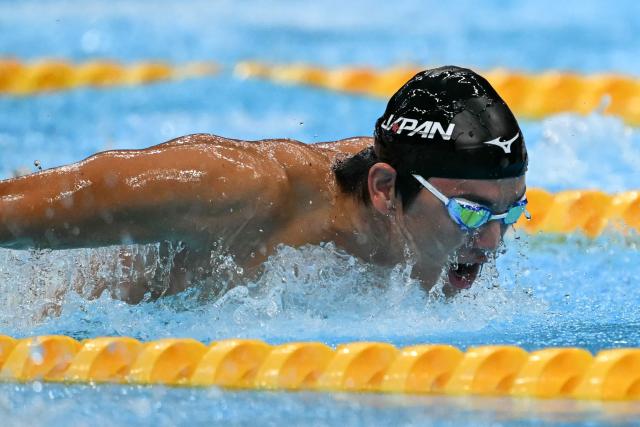 Japan's Shoon Mitsunaga competes in a heat of the men's 100m butterfly swimming event during the 2026 Asian Games at the Tokyo Aquatics Centre in Tokyo on September 23, 2026. (Photo by ANDREW CABALLERO-REYNOLDS / AFP)