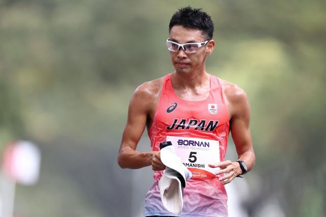 Japan's Toshikazu Yamanishi reacts after coming second place in the men's half marathon race walk at the 2026 Asian Games in Nagoya on September 23, 2026. (Photo by JIJI PRESS / AFP) / Japan OUT