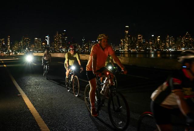 Cyclists take part in a ride along the Cinta Costera to mark World Car-Free Day in Panama City on September 22, 2026. (Photo by MARTIN BERNETTI / AFP)