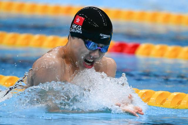 Hong Kong's Cheung Chi Kit Nicholas competes in a heat of the mixed 4 x 100m medley relay swimming event during the 2026 Asian Games at the Tokyo Aquatics Centre in Tokyo on September 23, 2026.  (Photo by ANDREW CABALLERO-REYNOLDS / AFP)