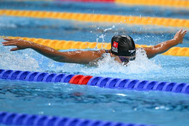 Hong Kong's Yeung Hoi Ching competes in a heat of the mixed 4 x 100m medley relay swimming event during the 2026 Asian Games at the Tokyo Aquatics Centre in Tokyo on September 23, 2026.  (Photo by ANDREW CABALLERO-REYNOLDS / AFP)
