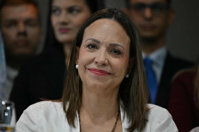 (FILES) Venezuelan opposition leader Maria Corina Machado looks on during a press conference in Panama City on May 23, 2026. The return to Venezuela of Venezuelan opposition leader Maria Corina Machado from her exile in Panama was again prevented on September 22, 2026, sources from her political party Vente Venezuela told AFP, without identifying those responsible. (Photo by MARTIN BERNETTI / AFP)