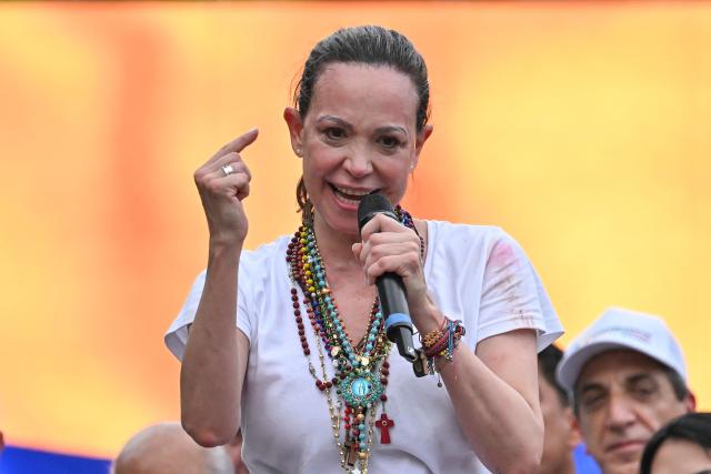 (FILES) Venezuelan opposition leader Maria Corina Machado gestures as she speaks to Venezuelan diaspora during a rally in Panama City on May 23, 2026. The return to Venezuela of Venezuelan opposition leader Maria Corina Machado from her exile in Panama was again prevented on September 22, 2026, sources from her political party Vente Venezuela told AFP, without identifying those responsible. (Photo by MARTIN BERNETTI / AFP)