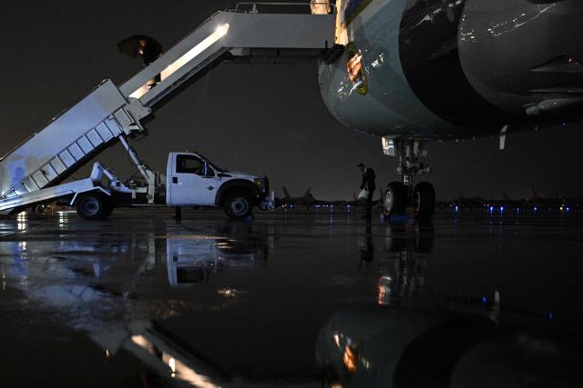 US President Donald Trump walks down the boarding stairs off Air Force One after landing at Joint Base Andrews in Maryland on September 22, 2026. Trump is returning to the White House after addressing the United Nations General Assembly in New York. (Photo by Brendan SMIALOWSKI / AFP)