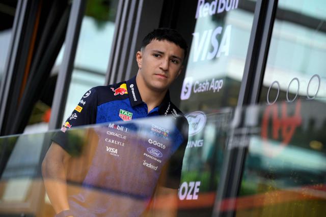 (FILES) Red Bull Racing's French driver Isack Hadjar walks in the paddock of the Spa-Francorchamps circuit, two days ahead of the Belgian Formula 1 Grand Prix on July 17, 2026. Frenchman Isack Hadjar will continue to partner Max Verstappen at Red Bull for the 2027 Formula One season, the team announced on September 23, 2026. (Photo by JOHN THYS / AFP)