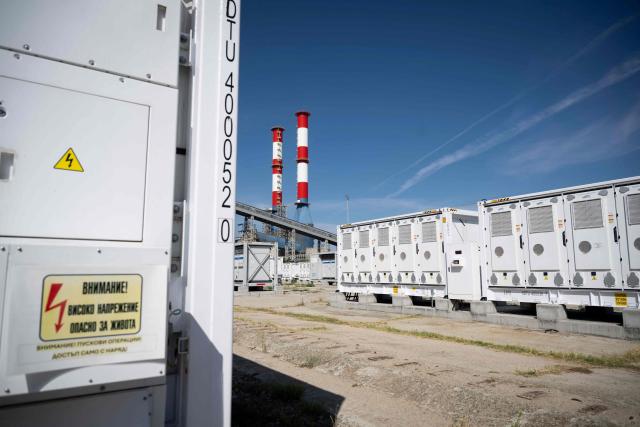 This photograph taken on September 18, 2026, shows Contur Global's 500 MWh battery energy storage system near the Maritsa East 3 TPP near Galabovo. As Eastern Europe's power sector has taken a hit from a record drought, Bulgaria has benefitted from a surge in solar-powered battery projects across the country. Around a hundred large battery energy storage system (BESS) sites are now operating, most of them built in the past two years. (Photo by Nikolay DOYCHINOV / AFP)