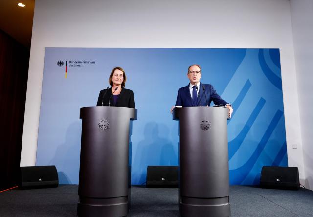 German Interior Minister Alexander Dobrindt (R) and State Secretary at the Federal Ministry of Labour and Social Affairs Leonie Gebers address a press conference 
on an action plan against social benefit fraud at the Interior Ministry in Berlin on September 23, 2026. (Photo by Odd ANDERSEN / AFP)
