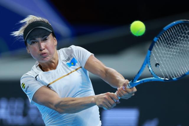 Kazakhstan’s Yulia Putintseva hits a return to Spain’s Christina Bucsa during their women’s singles quarter-final match at the Billie Jean King Cup tennis tournament in Shenzhen, in China’s southern Guangdong province on September 23, 2026. (Photo by CN-STR / AFP) / China OUT