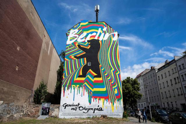 (FILES) A mural, part of the city of Berlin's campaign to host the Olympic Games in 2036, 2040, or 2044, reads: "Berlin wins with Olympia", in Berlin on June 15, 2026. According to German media reports on September 23, 2026, Berlin intends to withdraw its bid for the Olympic and Paralympic Games before the vote by the German Olympic Sports Confederation (DOSB) on Saturday, September 26. Berlin, together with Brandenburg, Saxony, and Mecklenburg-Western Pomerania, had aimed to host the Olympic Games in 2036, 2040, or 2044. (Photo by John MACDOUGALL / AFP)
