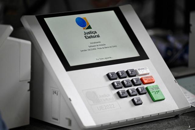 An electronic ballot box is pictured as it is prepared by electoral officials for the upcoming election in Brasilia on September 23, 2026. Brazil will hold a presidential election on October 4, 2026. (Photo by Evaristo Sa / AFP)