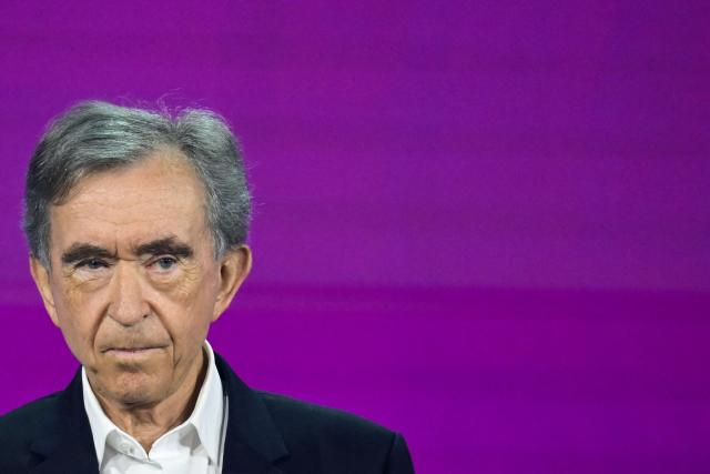 (FILES) LVMH chairman and CEO Bernard Arnault looks on as he delivers a speech during the opening ceremony at the VivaTech technology startups and innovation fair at the Paris Expo Porte de Versailles, in Paris on June 17, 2026. The Arnault family-owned group intends to streamline the structure that controls the global luxury giant LVMH through a series of mergers and reorganisations, Christian Dior announced in a press release on September 23, 2026. (Photo by JULIEN DE ROSA / AFP)