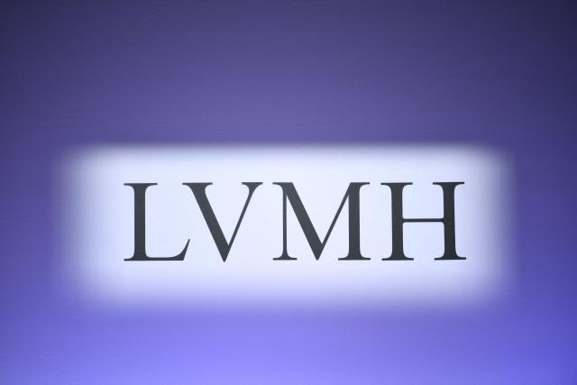 (FILES) This photograph taken on January 25, 2024 shows the logo of World's top luxury group LVMH during presentation of its 2023 annual results in Paris, on January 25, 2024. The Arnault family-owned group intends to streamline the structure that controls the global luxury giant LVMH through a series of mergers and reorganisations, Christian Dior announced in a press release on September 23, 2026. (Photo by STEPHANE DE SAKUTIN / AFP)