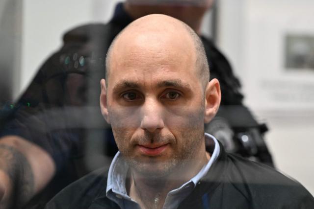 (FILES) Cedric Jubillar is pictured in the courtroom of the Tarn Assizes at the opening of a hearing in his trial for the murder of his wife Delphine Jubillar, in Albi on September 23, 2025. Cedric Jubillar, who was convicted at first instance on the basis of a body of circumstantial evidence, finally confessed to the murder of his wife ahead of his appeal hearing, thereby reinforcing a legal case that will go down “in the history of crime”, as Chantal Ferreira, the President of the Toulouse Court of Appeal, emphasised on September 23, 2026. (Photo by Lionel BONAVENTURE / AFP)