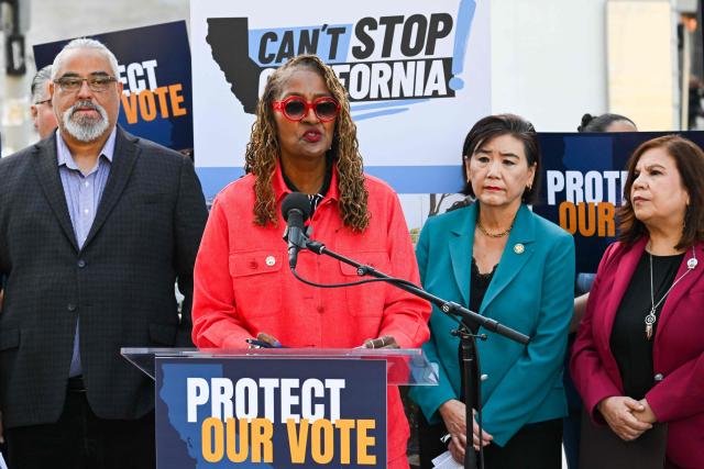 (L/R) Los Angeles County Supervisor Holly J. Mitchell (C) speaks  alongside speaks as US Representative Judy Chu, Democrat from California, looks on during a news conference about protecting voting rights ahead of the November midterm elections, in Los Angeles, California on September 23, 2026. (Photo by Patrick T. Fallon / AFP)