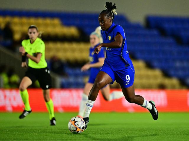 Chelsea's French striker #09 Melvine Malard runs with the ball during the UEFA Women's Champions League football match between Chelsea and Austria Wien at the Cherry Red Records Stadium in Wimbledon, south-west London on September 23, 2026. (Photo by Ben STANSALL / AFP)