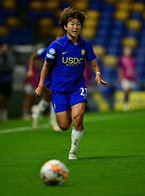 Chelsea's Japanese striker #23 Maika Hamano chases the ball during the UEFA Women's Champions League football match between Chelsea and Austria Wien at the Cherry Red Records Stadium in Wimbledon, south-west London on September 23, 2026. (Photo by Ben STANSALL / AFP)