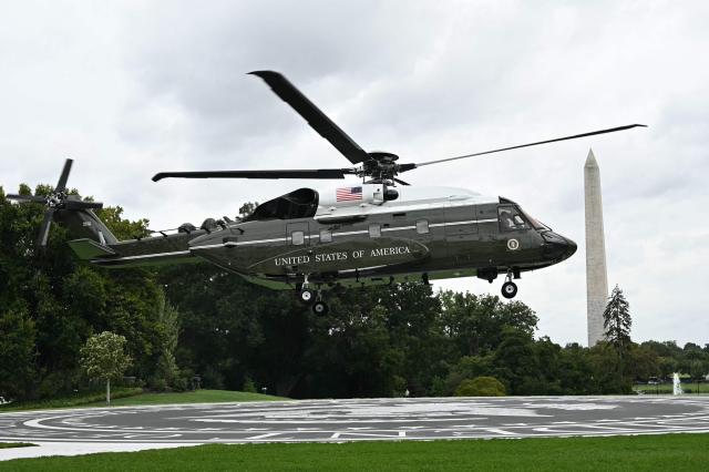 US President Donald Trump and First Lady Melania Trump on board Marine One depart from the South Lawn of the White House in Washington, DC, on September 23, 2026. The Trumps are heading to Joint Base Andrews to greet Chinese President Xi Jinping. (Photo by Alex WROBLEWSKI / AFP)