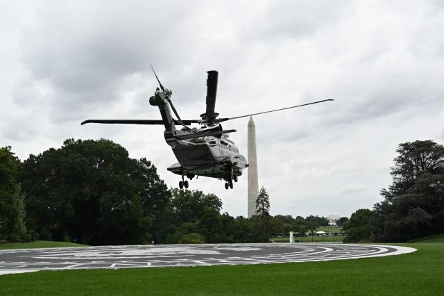 US President Donald Trump and First Lady Melania Trump on board Marine One depart from the South Lawn of the White House in Washington, DC, on September 23, 2026. The Trumps are heading to Joint Base Andrews to greet Chinese President Xi Jinping. (Photo by Alex WROBLEWSKI / AFP)