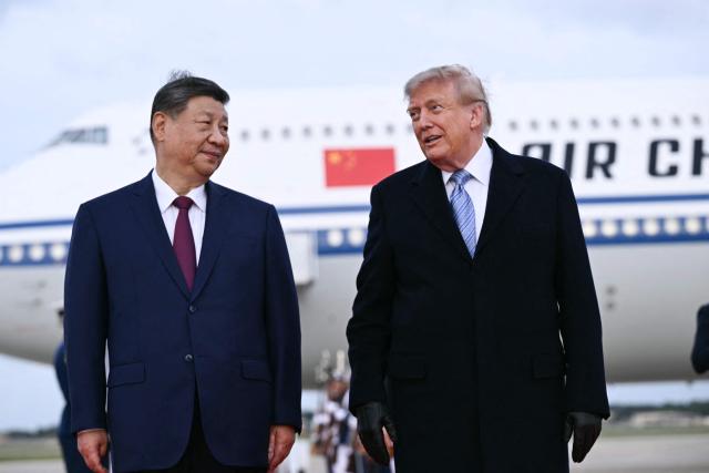 US President Donald Trump greets Chinese President Xi Jinping upon arrival at Joint Base Andrews in Maryland on September 23, 2026. Xi is visiting the United States from September 23 to 25. (Photo by Brendan SMIALOWSKI / AFP)