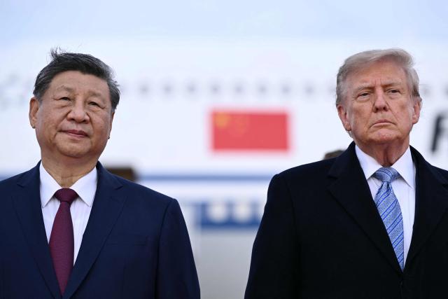 US President Donald Trump greets Chinese President Xi Jinping upon arrival at Joint Base Andrews in Maryland on September 23, 2026. Xi is visiting the United States from September 23 to 25. (Photo by Brendan SMIALOWSKI / AFP)