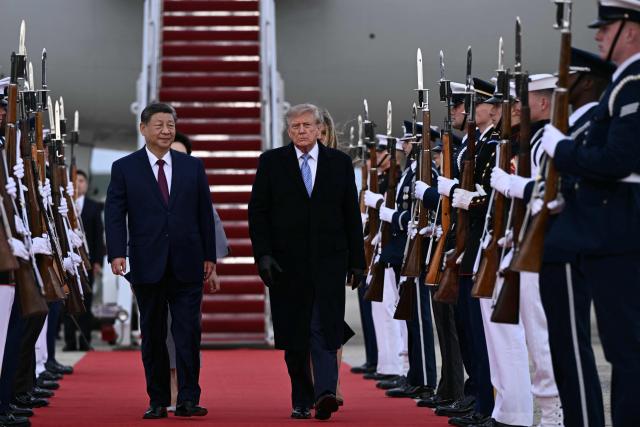 US President Donald Trump greets Chinese President Xi Jinping upon arrival at Joint Base Andrews in Maryland on September 23, 2026. Xi is visiting the United States from September 23 to 25. (Photo by Brendan SMIALOWSKI / AFP)