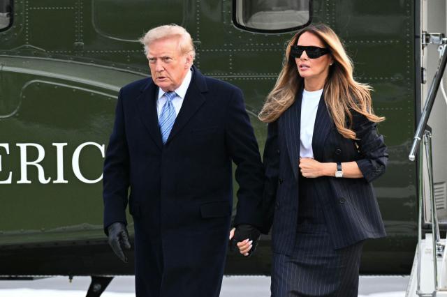 US President Donald Trump (L) and First Lady Melania Trump step off Marine One on the South Lawn of the White House in Washington, DC, on September 23, 2026. Trump is returning from Joint Base Andrews where he greeted the visiting Chinese President Xi Jinping. (Photo by Alex WROBLEWSKI / AFP)