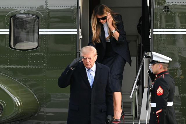 US President Donald Trump and First Lady Melania Trump step off Marine One on the South Lawn of the White House in Washington, DC, on September 23, 2026. Trump is returning from Joint Base Andrews where he greeted the visiting Chinese President Xi Jinping. (Photo by Alex WROBLEWSKI / AFP)