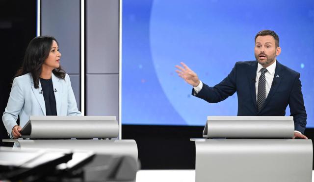 Quebec solidaire's (QS) co-spokesperson Ruba Ghazal (L) and Leader of the Parti Quebecois (PQ) Paul St-Pierre Plamondon (R) participate in the third and final televised Quebec election debate in Montreal, Quebec, Canada on September 23, 2026. Quebec voters will cast their vote on October 5. (Photo by Graham Hughes / POOL / AFP)