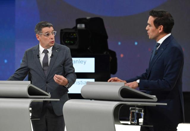 Leader of the Conservative Party of Quebec (PCQ) Eric Duhaime (L) and Leader of the Quebec Liberal Party (PLQ) Charles Milliard (R) participate in the third and final televised Quebec election debate in Montreal, Quebec, Canada on September 23, 2026. Quebec voters will cast their vote on October 5. (Photo by Graham Hughes / POOL / AFP)