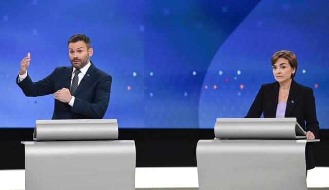 Leader of the Parti Quebecois (PQ) Paul St-Pierre Plamondon (L) and Leader of the Coalition Avenir Quebec (CAQ) Christine Frechette (R) participate in the third and final televised Quebec election debate in Montreal, Quebec, Canada on September 23, 2026. Quebec voters will cast their vote on October 5. (Photo by Graham Hughes / POOL / AFP)