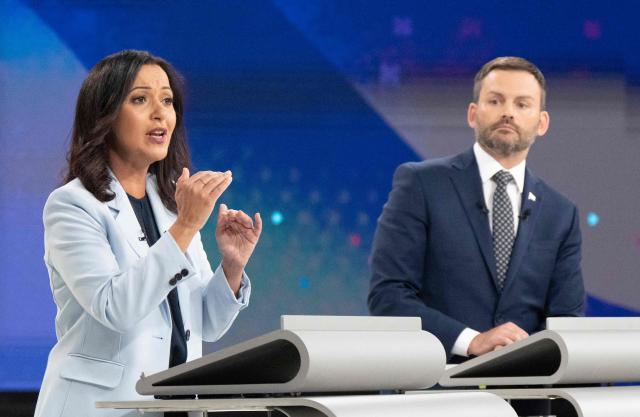 Quebec solidaire's (QS) co-spokesperson Ruba Ghazal (L) and Leader of the Parti Quebecois (PQ) Paul St-Pierre Plamondon participate in the third and final televised Quebec election debate in Montreal, Quebec, Canada on September 23, 2026. Quebec voters will cast their vote on October 5. (Photo by Christopher Katsarov / POOL / AFP)