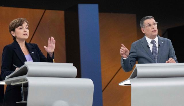 Leader of the Coalition Avenir Quebec (CAQ) Christine Frechette (L) and Leader of the Conservative Party of Quebec (PCQ) Eric Duhaime (R) participate in the third and final televised Quebec election debate in Montreal, Quebec, Canada on September 23, 2026. Quebec voters will cast their vote on October 5. (Photo by Christopher Katsarov / POOL / AFP)